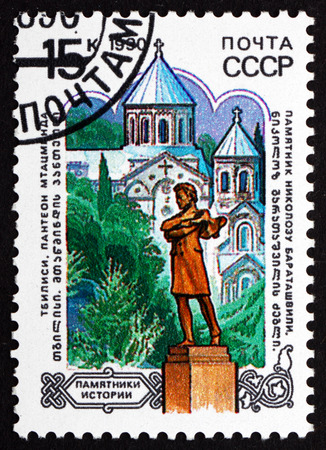 RUSSIA - CIRCA 1990: a stamp printed in the Russia shows Statue of Nicholas Baratashvili and Mtasminda Pantheon, Tbilisi, circa 1990のeditorial素材