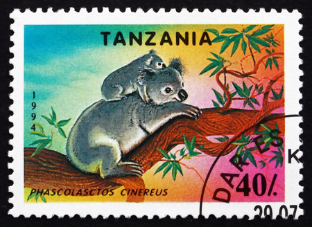 TANZANIA - CIRCA 1994: a stamp printed in Tanzania shows Koala, Phascolasctos Cinereus, Arboreal Herbivorous Marsupial Native to Australia, circa 1994のeditorial素材