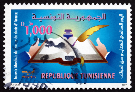 TUNISIA - CIRCA 1997: a stamp printed in Tunisia shows World Book and Copyright Day, circa 1997のeditorial素材