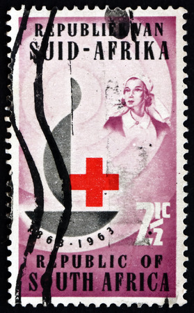 SOUTH AFRICA - CIRCA 1963: a stamp printed in South Africa shows Centenary Emblem and Nurse, Centenary of the International Red Cross, circa 1963のeditorial素材