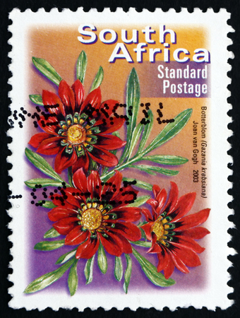 SOUTH AFRICA - CIRCA 2003: a stamp printed in South Africa shows Botterblom, Gazania Krebsiana, Flowering Plant, circa 2003のeditorial素材