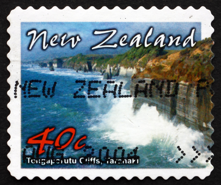 NEW ZEALAND - CIRCA 2002: a stamp printed in the New Zealand shows Tongaporutu Cliffs, Taranaki, Scenic Coastline, circa 2002のeditorial素材