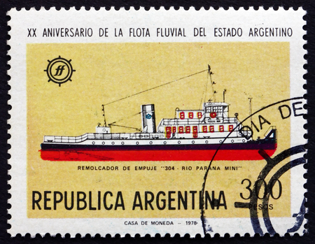 ARGENTINA - CIRCA 1978: a stamp printed in the Argentina shows River Parana Tug No.34, National River Fleet, circa 1978のeditorial素材