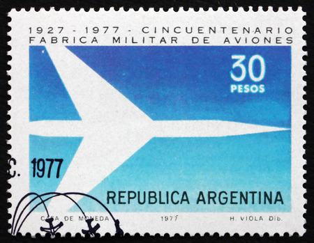 ARGENTINA - CIRCA 1977: a stamp printed in the Argentina shows Jet, 50th Anniversary of Military Plane Production,  circa 1977のeditorial素材