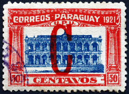 PARAGUAY - CIRCA 1922: a stamp printed in Paraguay shows Parliament Building, Asuncion, circa 1922のeditorial素材