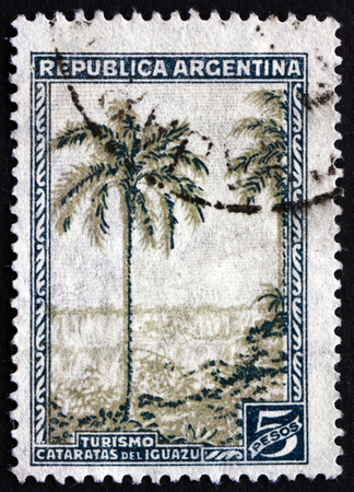 ARGENTINA - CIRCA 1936: a stamp printed in the Argentina shows Iguacu Falls, Scenic Wonder, circa 1936のeditorial素材