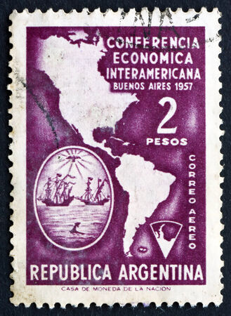 ARGENTINA - CIRCA 1957: a stamp printed in the Argentina shows Map of Americas and Arms of Buenos Aires, Inter-American Economic Conference in Buenos Airesのeditorial素材