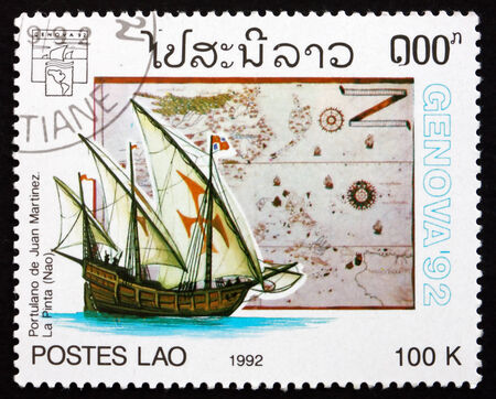 LAOS - CIRCA 1992: a stamp printed in Laos shows Sailing ship and Map by Juan Martinez, circa 1992のeditorial素材