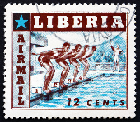 LIBERIA - CIRCA 1955: a stamp printed in the Liberia shows Swimming, Sport, circa 1955のeditorial素材