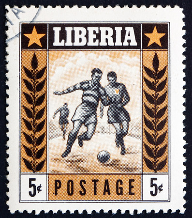 LIBERIA - CIRCA 1955: a stamp printed in the Liberia shows Soccer Players in Action, Sport, circa 1955のeditorial素材