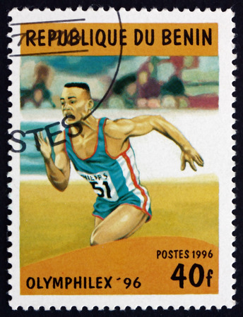 BENIN - CIRCA 1996: a stamp printed in the Benin shows Running, Sport, circa 1996のeditorial素材
