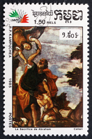 CAMBODIA - CIRCA 1985: a stamp printed in Cambodia shows Sacrifice of Abraham, Painting by Paolo Veronese, Italian Painter, circa 1985のeditorial素材