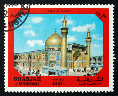 SHARJAH - CIRCA 1972: a stamp printed in the Sharjah UAE shows Holy City of Najaf al Ashraf, Ancient City of the Middle East, circa 1972のeditorial素材