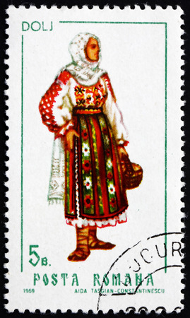 ROMANIA - CIRCA 1969: a stamp printed in the Romania shows Woman from Dolj, Traditional Regional Costume, circa 1969のeditorial素材