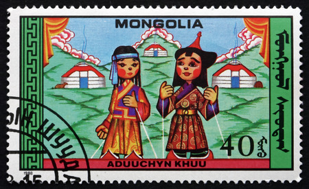 MONGOLIA - CIRCA 1988: a stamp printed in Mongolia shows Puppets from Aduuchyn Khuu, Folk Tale, circa 1988のeditorial素材