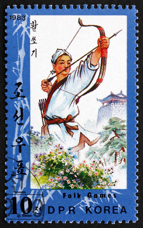 NORTH KOREA - CIRCA 1983: a stamp printed in North Korea shows Archery, Folk Games, circa 1983のeditorial素材