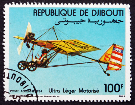 DJIBOUTI - CIRCA 1984: a stamp printed in the Djibouti shows Motorized Hang Glider, circa 1984のeditorial素材
