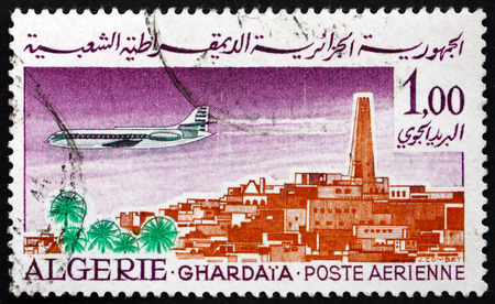 ALGERIA - CIRCA 1967: a stamp printed in Algeria shows Caravelle over Ghardaia, circa 1967のeditorial素材