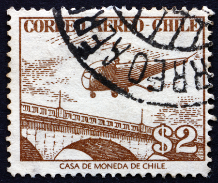 CHILE - CIRCA 1956: a stamp printed in the Chile shows Helicopter over Bridge, circa 1956のeditorial素材