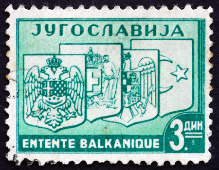 YUGOSLAVIA - CIRCA 1937: a stamp printed in the Yugoslavia shows Coats of Arms of Yugoslavia, Greece, Romania and Turkey, Balkan Entente, circa 1937のeditorial素材