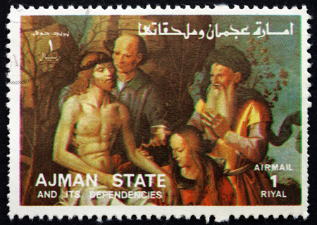 AJMAN - CIRCA 1973: a stamp printed in the Ajman shows The Descent from the Cross, Life of Jesus, circa 1973のeditorial素材