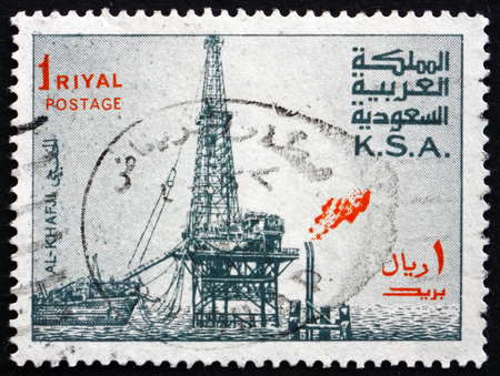 SAUDI ARABIA - CIRCA 1976: a stamp printed in the Saudi Arabia shows Al Khafji Oil Rig, circa 1976のeditorial素材