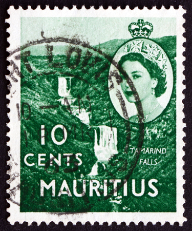 MAURITIUS - CIRCA 1953: a stamp printed in the Mauritius shows Tamarind Falls, circa 1953のeditorial素材