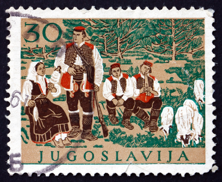 YUGOSLAVIA - CIRCA 1957: a stamp printed in the Yugoslavia shows Croatian National Costume, circa 1957のeditorial素材