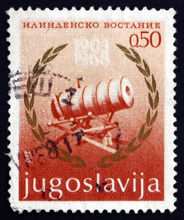 YUGOSLAVIA - CIRCA 1968: a stamp printed in the Yugoslavia shows Cannon and Laurel Wreath, 65th Anniversary of the Ilinden Uprising, Macedonia, circa 1968のeditorial素材