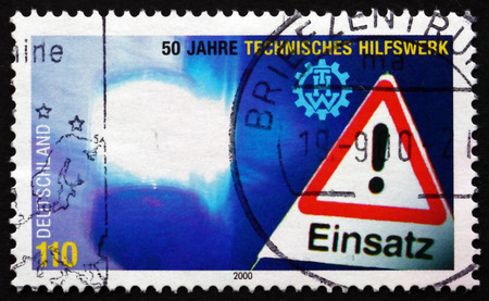 GERMANY - CIRCA 2000: a stamp printed in the Germany shows Federal Disaster Relief Organization, 50th Anniversary, circa 2000のeditorial素材
