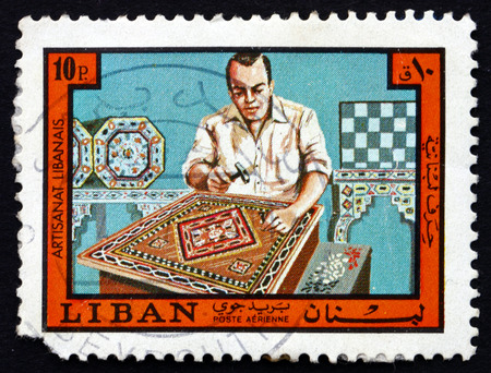 LEBANON - CIRCA 1973: a stamp printed in the Lebanon shows Inlay Worker, Lebanese Handicraft, circa 1973のeditorial素材
