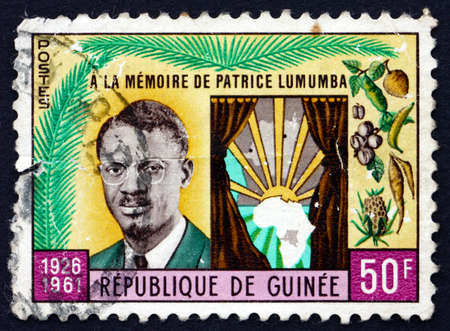 GUINEA - CIRCA 1962: a stamp printed in the Guinea shows Patrice Lumumba and Map of Africa, Death Anniversary of Patrice Lumumba, Premier of the Congo Republic, circa 1962のeditorial素材
