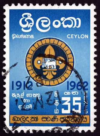 SRI LANKA - CIRCA 1962: a stamp printed in Sri Lanka shows Badge of Singhalese Scouts, Boy Scouts of Ceylon, 50th Anniversary, circa 1962のeditorial素材