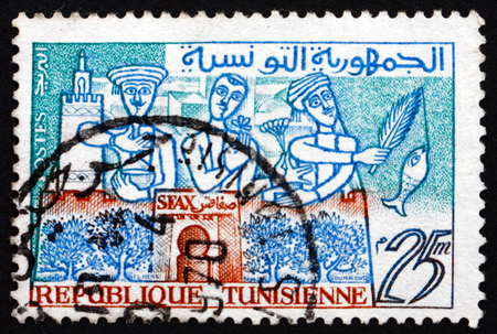TUNISIA - CIRCA 1960: a stamp printed in Tunisia shows Oil, Flowers and Fish of Sfax, the Capital of the Sfax Governorate and Mediterranean Port, circa 1960のeditorial素材