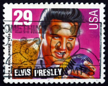 USA - CIRCA 1993: a stamp printed in the USA shows Elvis Presley, American Singer and Actor, the King of Rock and Roll, circa 1993のeditorial素材