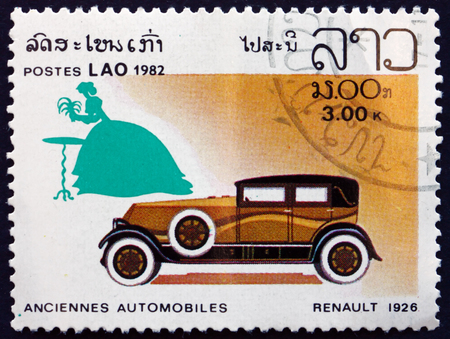 LAOS - CIRCA 1982: a stamp printed in Laos shows 1926 Renault, Classic Automobile, circa 1982のeditorial素材