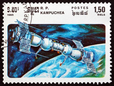 CAMBODIA - CIRCA 1985: a stamp printed in Cambodia shows Soyuz 4 Docked with Soyuz 5, Soviet Space Achievements, circa 1985のeditorial素材