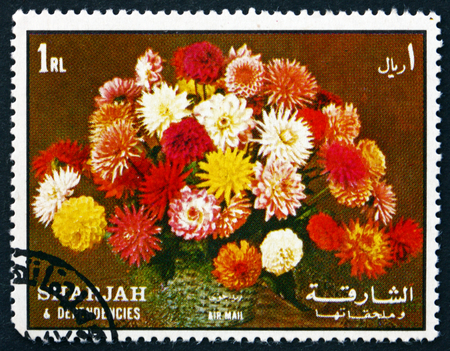 SHARJAH - CIRCA 1972: a stamp printed in the Sharjah UAE shows Flower Bouquet, Dahlias, circa 1972のeditorial素材