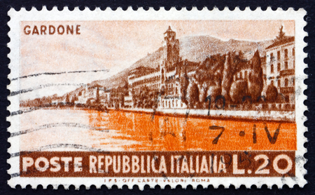 ITALY - CIRCA 1953: a stamp printed in the Italy shows Seaside at Gardone, circa 1953のeditorial素材