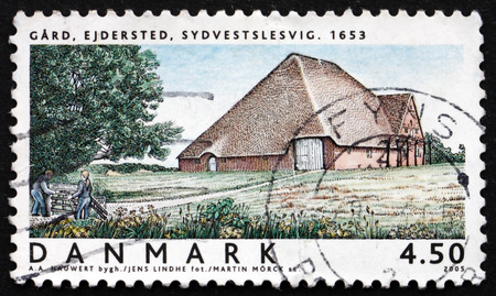 DENMARK - CIRCA 2005: a stamp printed in the Denmark shows Ejdersted Farm, Southwest Schleswig, circa 2005のeditorial素材