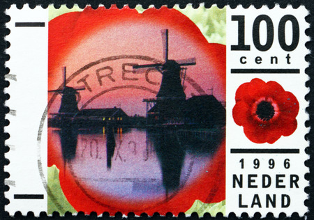NETHERLANDS - CIRCA 1996: a stamp printed in the Netherlands shows Windmills at Zaanse Schans Open Air Museum, Anemone, circa 1996のeditorial素材