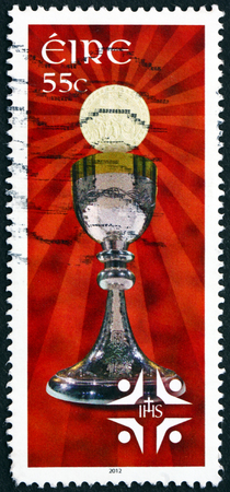 IRELAND - CIRCA 2012: a stamp printed in the Ireland shows Chalice and Hostie, International Eucharistic Congress, Dublin, circa 2012のeditorial素材