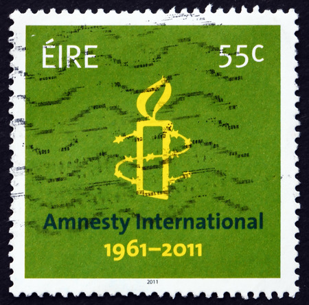 IRELAND - CIRCA 2011: a stamp printed in the Ireland shows Amnesty International, 50th Anniversary, circa 2011のeditorial素材