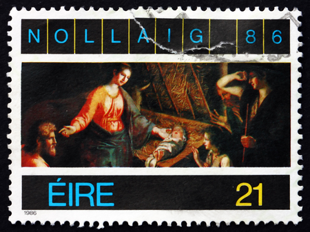 IRELAND - CIRCA 1987: A stamp printed in Ireland shows Adoration of the Shepherds, Painting by Francesco Pascucci, Christmas, circa 1987のeditorial素材