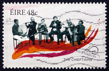 IRELAND - CIRCA 2006: A stamp printed in Ireland shows The Chieftains, Traditional Irish Music Group, circa 2006のeditorial素材
