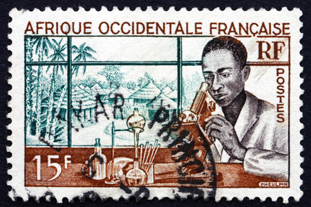 FRENCH WEST AFRICA - CIRCA 1953: a stamp printed in France shows Medical Laboratory, circa 1953のeditorial素材