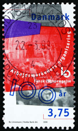 DENMARK - CIRCA 1998: a stamp printed in Denmark dedicated to Danish Confederation of Trade Unions, Centenary, circa 2000のeditorial素材