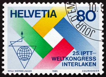 SWITZERLAND - CIRCA 1985: a stamp printed in the Switzerland dedicated to Postal, Telegraph and Telephone International Congress, Interlaken, circa 1985のeditorial素材