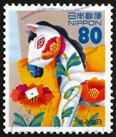 JAPAN - CIRCA 1996: a stamp printed in the Japan shows Horse Toy, Child's Drawing, Letter Writing Day, circa 1996のeditorial素材