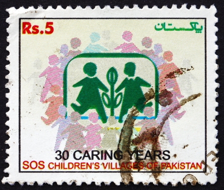 PAKISTAN - CIRCA 2005: a stamp printed in Pakistan dedicated to SOS Childrens Villages in Pakistan, 30th Anniversary, circa 2005のeditorial素材